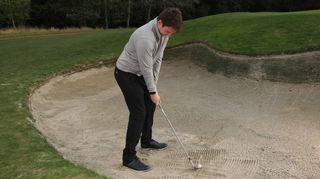 Adidas Frostguard Insulated Trousers, man playing bunker shot