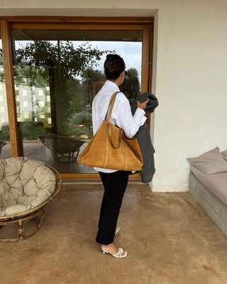 influencer wearing sezane suede handbag