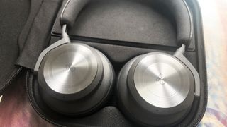 the beoplay hx headphones in their carrying case