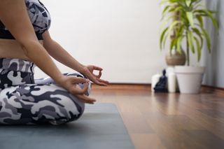 Menopause yoga: a woman practicing meditation