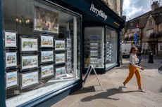 Houses for sale in an estate agents window