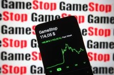 GameStop stock chart on smartphone with GameStop logo in red in black in background
