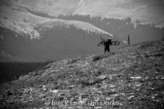 A racer hike-a-bikes up Wheeler Pass on stage 5 of the Breck Epic.