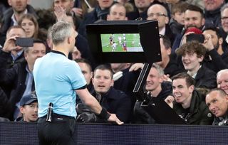 Referee Bjorn Kuipers checks with VAR before awarding Manchester City a penalty against Spurs