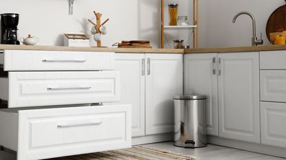 Trash can in white kitchen