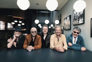 Deep Purple seated at a table