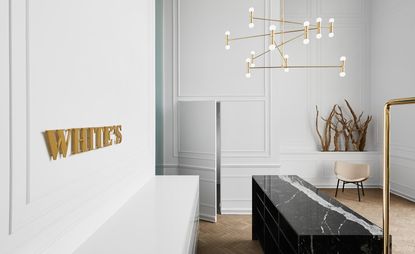 Black marble counter and brass light fitting