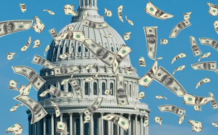 money floating down with U.S. capitol building in the background