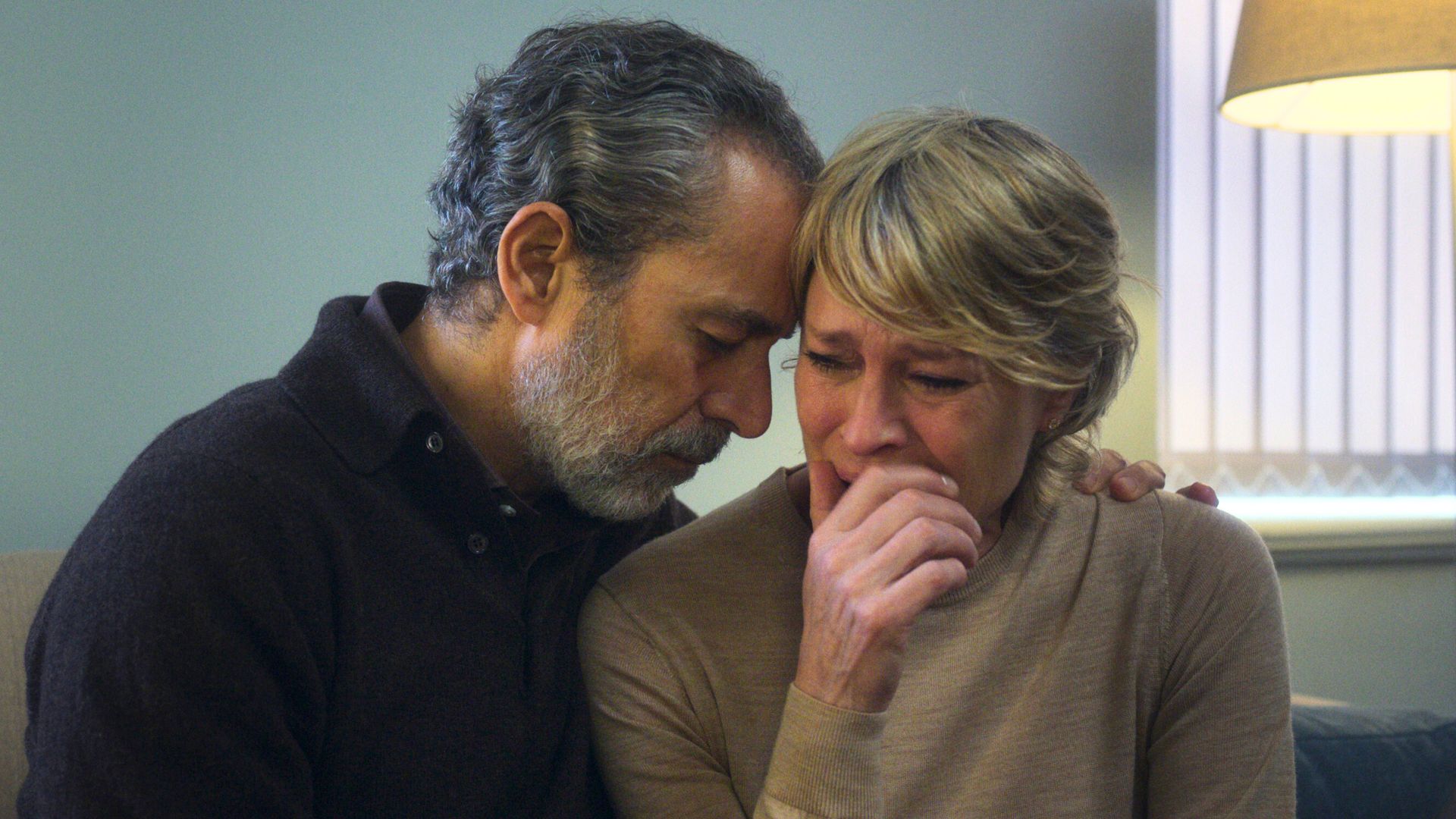 Waleed Zuaiter comforts Robin Wright as she cries