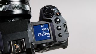 A photo of the Fujifilm X-H2S settings display against a grey background.