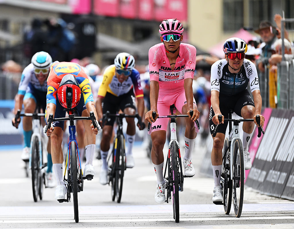 CASTELNOVO NE MONTI ITALY MAY 21 LR Giulio Ciccone of Italy and Team Lidl Trek Isaac Del Toro of Mexico and Team UAE Team Emirates XRG Pink Leader Jersey and Thomas Pidcock of Great Britain and Team Q365 Pro Cycling cross the finish line during the 108th Giro dItalia 2025 Stage 11 a 186km stage from Viareggio to Castelnovo ne Monti 715m UCIWT on May 21 2025 in Castelnovo ne Monti Italy Photo by Dario BelingheriGetty Images