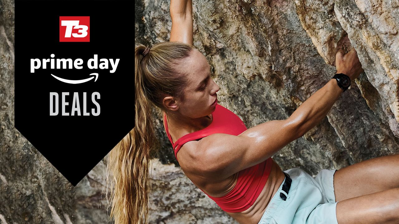 Female climber scaling a rock face wearing the Garmin Fenix 7X Solar