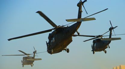 Marine helicopters fly above Baghdad