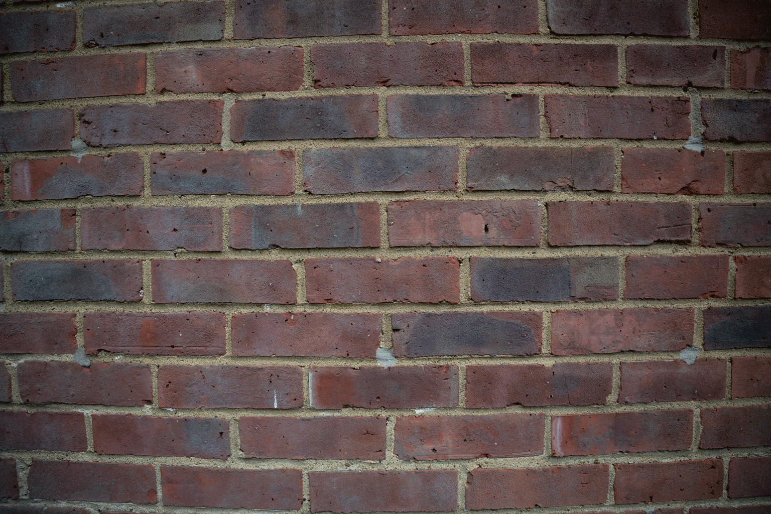 Sigma 10-18mm f/2.8 lens distortion test GIF of a brick wall