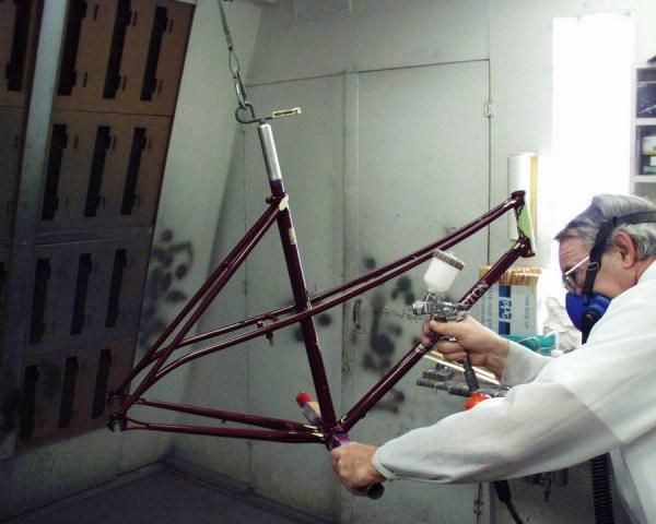 Joe Bell applies one of 17 separate coats to Shelly Horton's Bilenky Cycle Works frame.