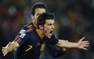 David Villa celebrates with Cesc Fabregas after scoring for Spain against Paraguay at the 2010 World Cup.