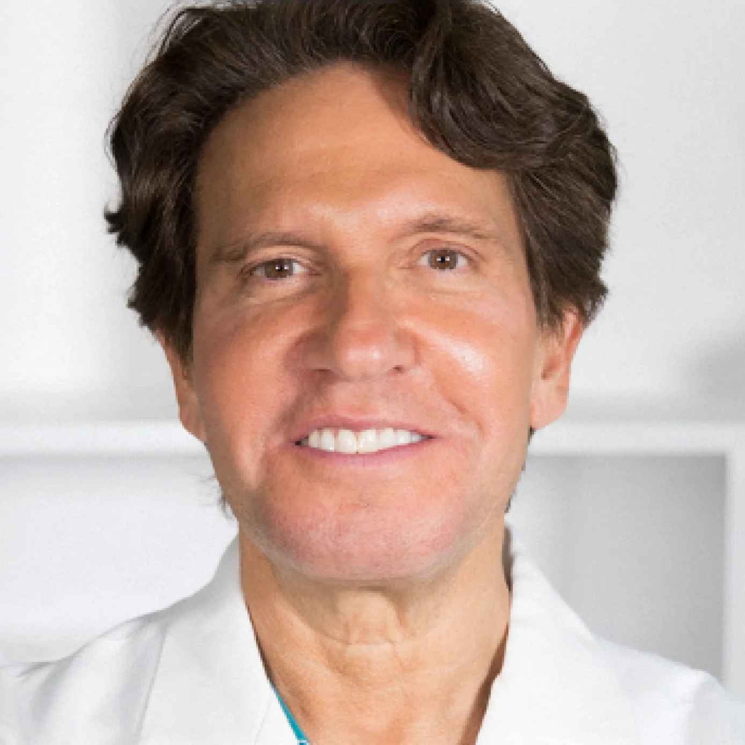 Image of Dr Dennis Gross smiling with brunette short hair