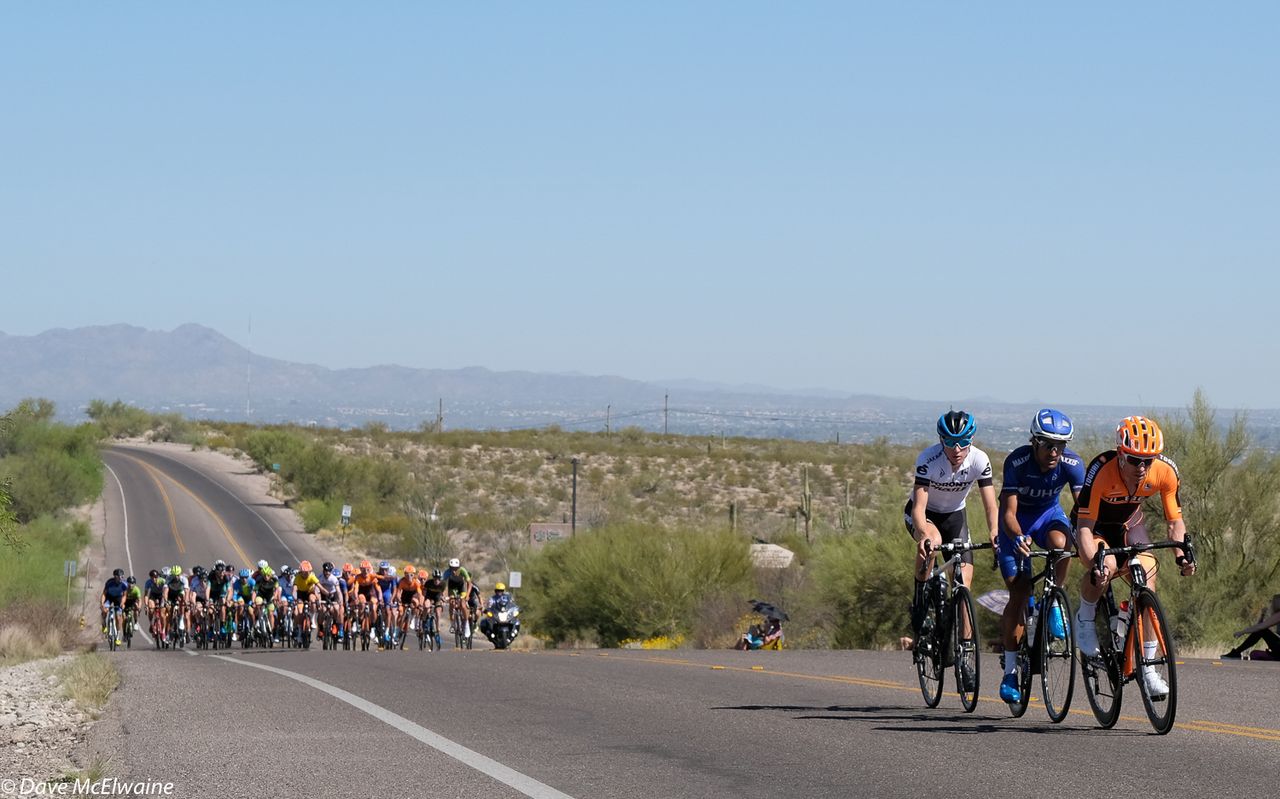 A three-man breakaway during the third lap