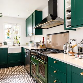 kitchen with green cabinet and white worktops