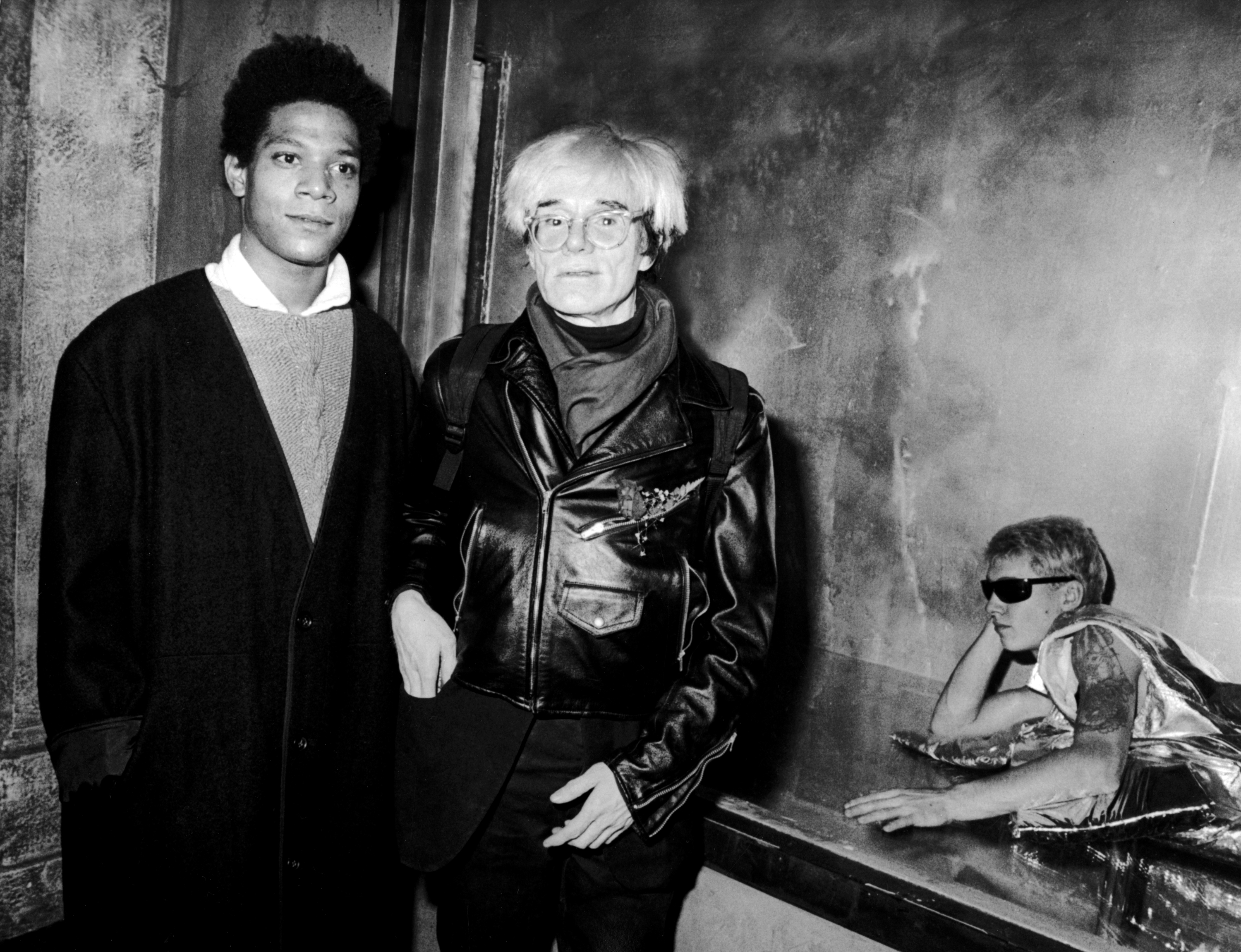 NEW YORK CITY - NOVEMBER 7: Jean-Michel Basquiat and Andy Warhol attend "Gifts For The City Of New York" Benefit for Brooklyn Academy of Music on November 7, 1984 at Area Nightclub in New York City. (Photo by Ron Galella/Ron Galella Collection via Getty Images)