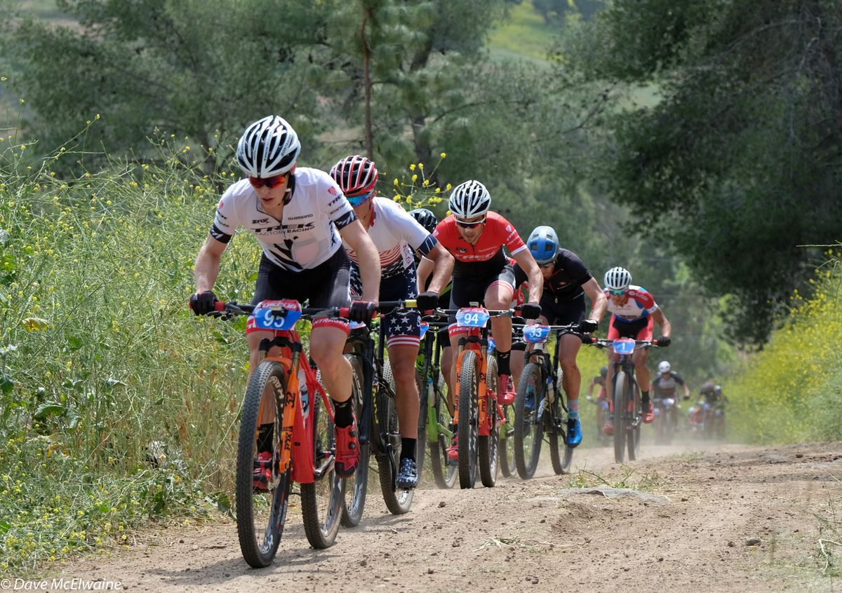Anton Cooper (Trek) leading on the long fire road climb