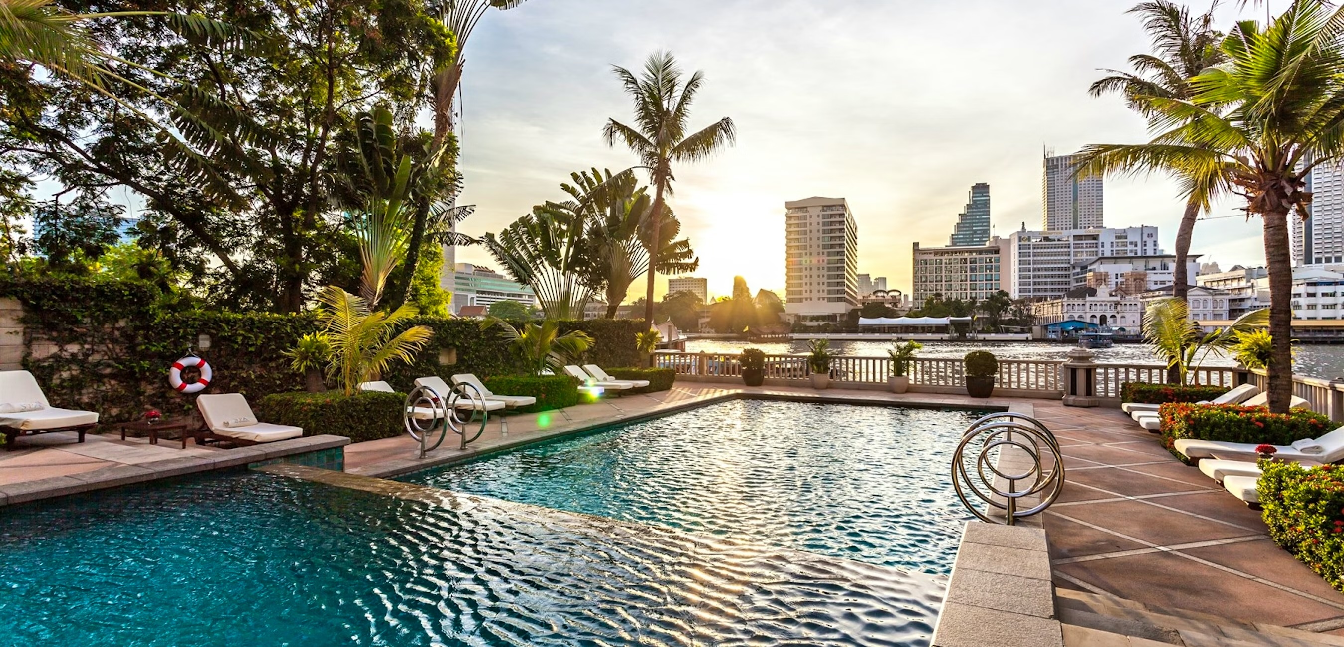 Swimming pool jutting out over a river in Bangkok, Thailand