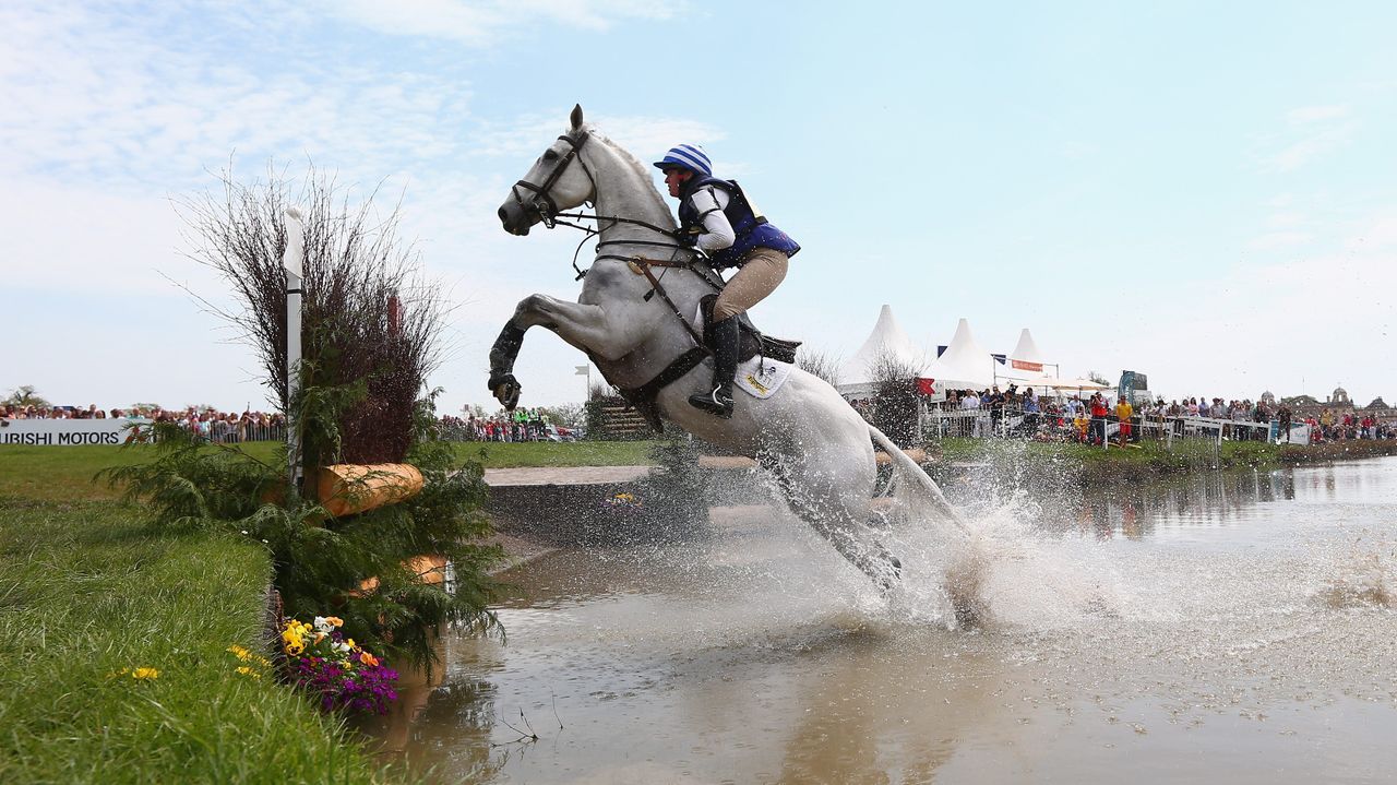 Olivia Wilmot of Great Britain riding Cool Dancer clears the lake fence during the cross-country at the Badminton Horse Trials.