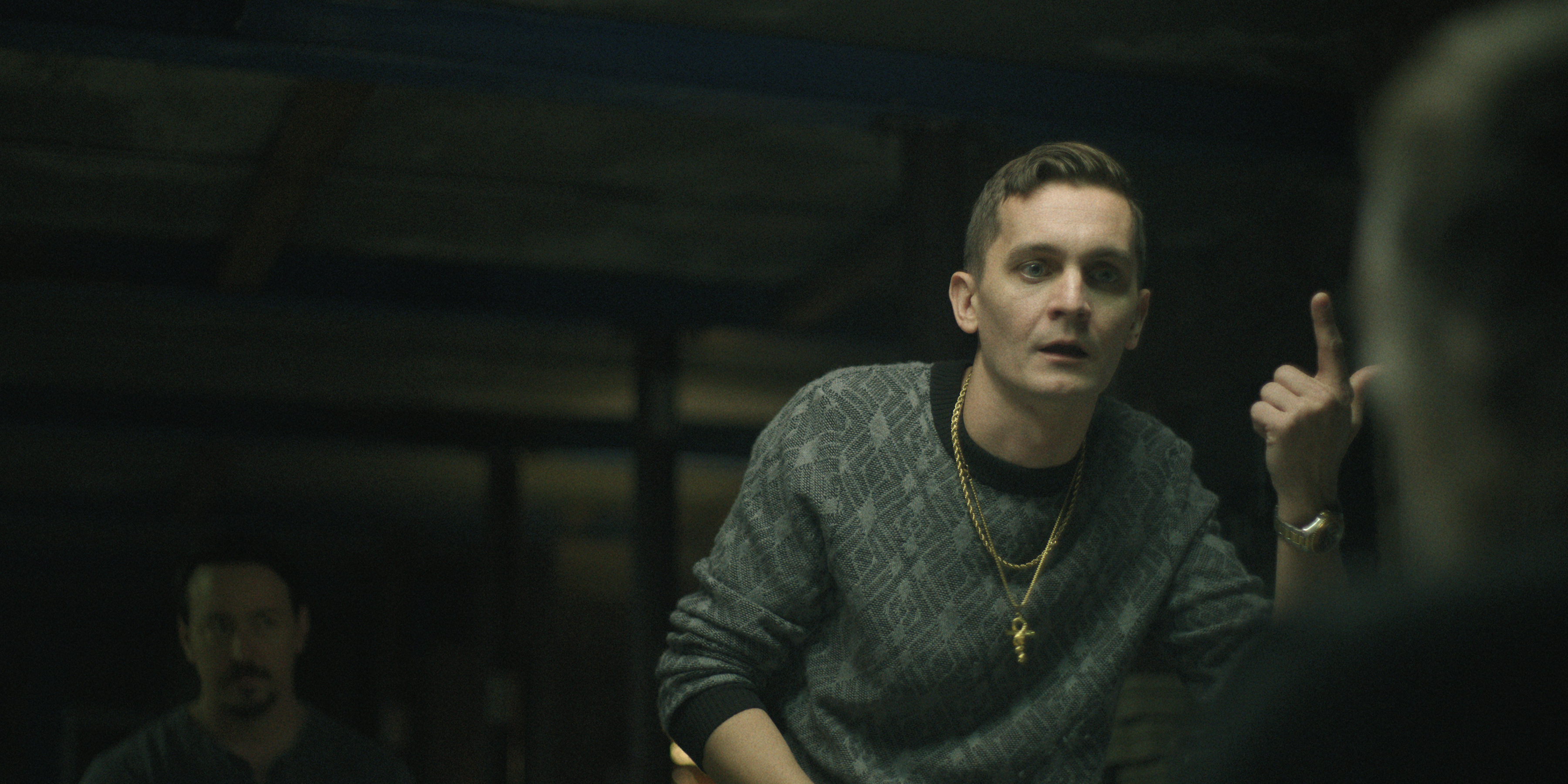 forrest weber as junior interrogating someone in black rabbit