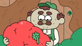 Herbert the gardener, as voiced by Matt Berry in Thank Goodness You're Here, looks at a large and bulbous tomato