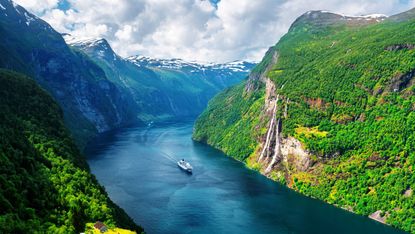 Sunnylvsfjorden fjord and Seven Sisters waterfalls near Geiranger in Norway 