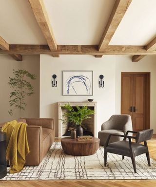 Modern rustic living room, beamed ceiling, fireplace, cozy seating