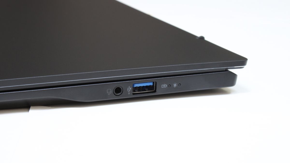 Acer Swift 16 AI (Intel) closed at an angle on a white surface showing the ports on it right side.