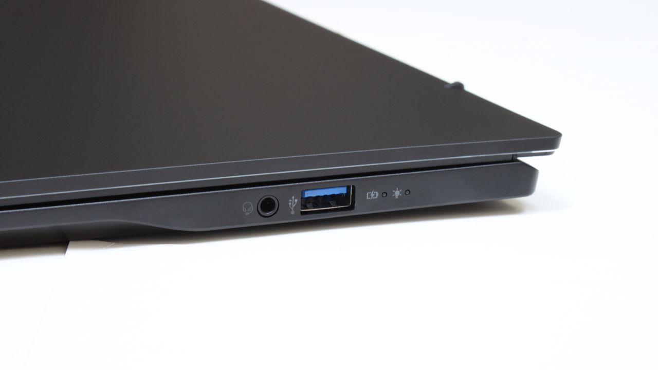 Acer Swift 16 AI (Intel) closed at an angle on a white surface showing the ports on it right side.