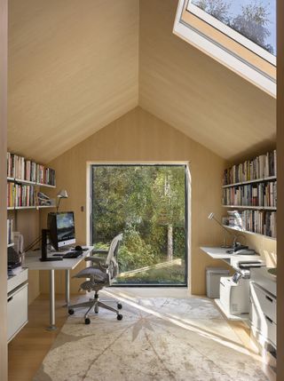 Home office with work desk chair and bookshelf