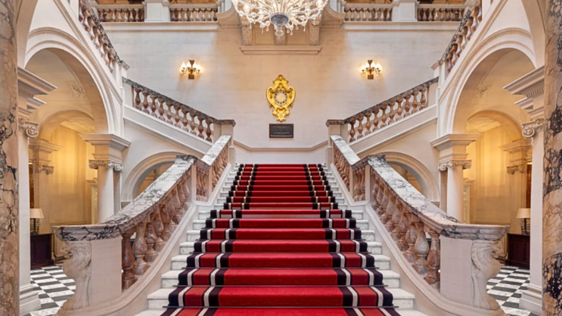 an image of the interior staircase at Raffles London, the former war office