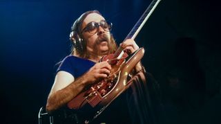 Jeff 'Skunk' Baxter of The Doobie Brothers performing on stage at Nippon Budokan, Tokyo, Japan, February 1979. He is playing a Burns guitar.