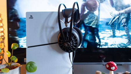 Meze 105 AER wired headphones being used with a PS5 Slim