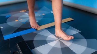 Person stepping on disc for gait analysis