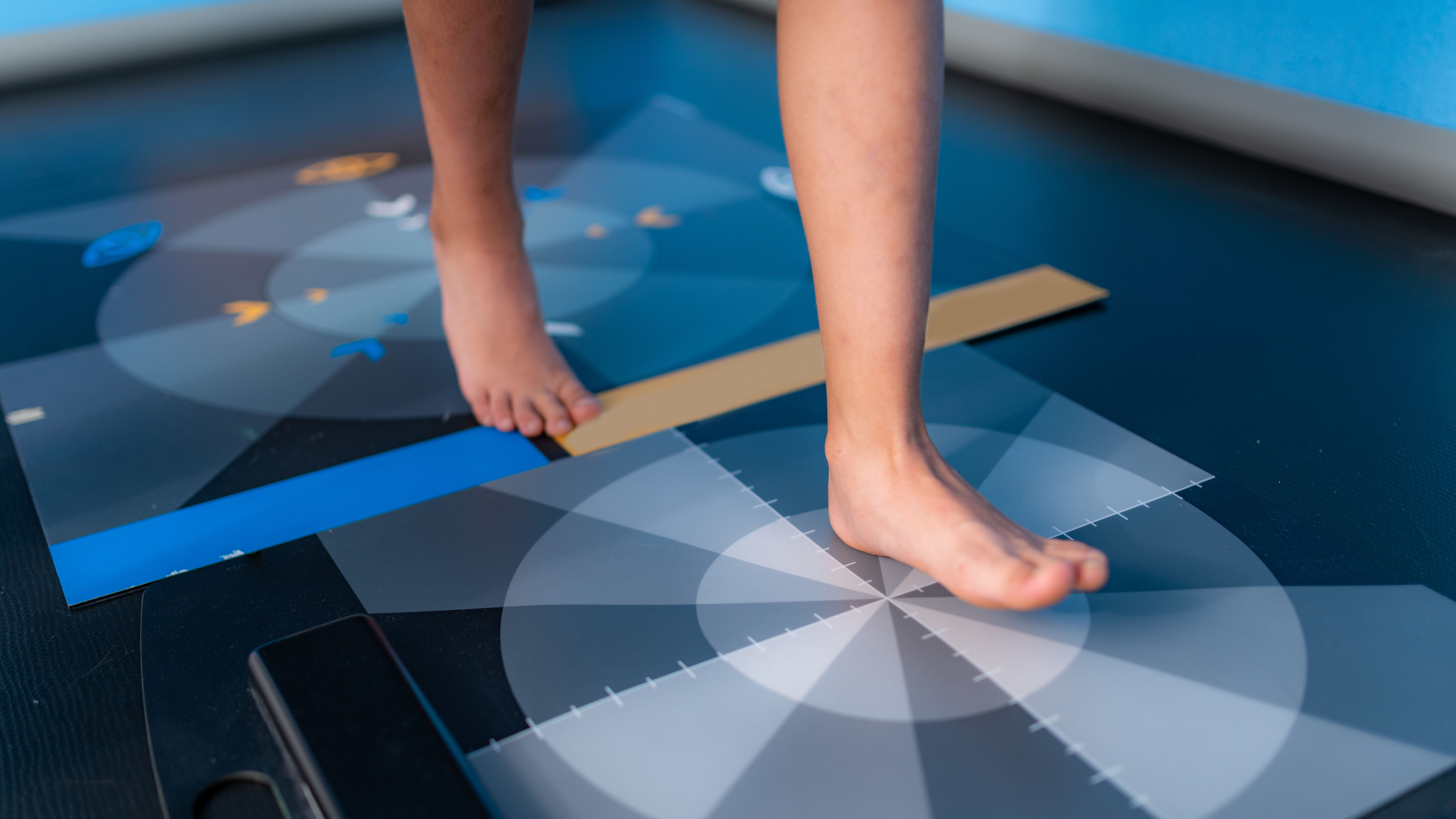Person stepping on disc for gait analysis