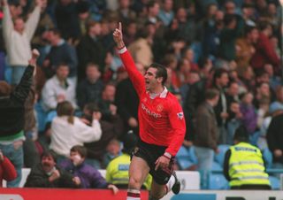 Eric Cantona celebrates a goal for Manchester United against Manchester City in March 1993.