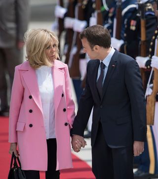 Brigitte Macron’s bubblegum pink trench coat