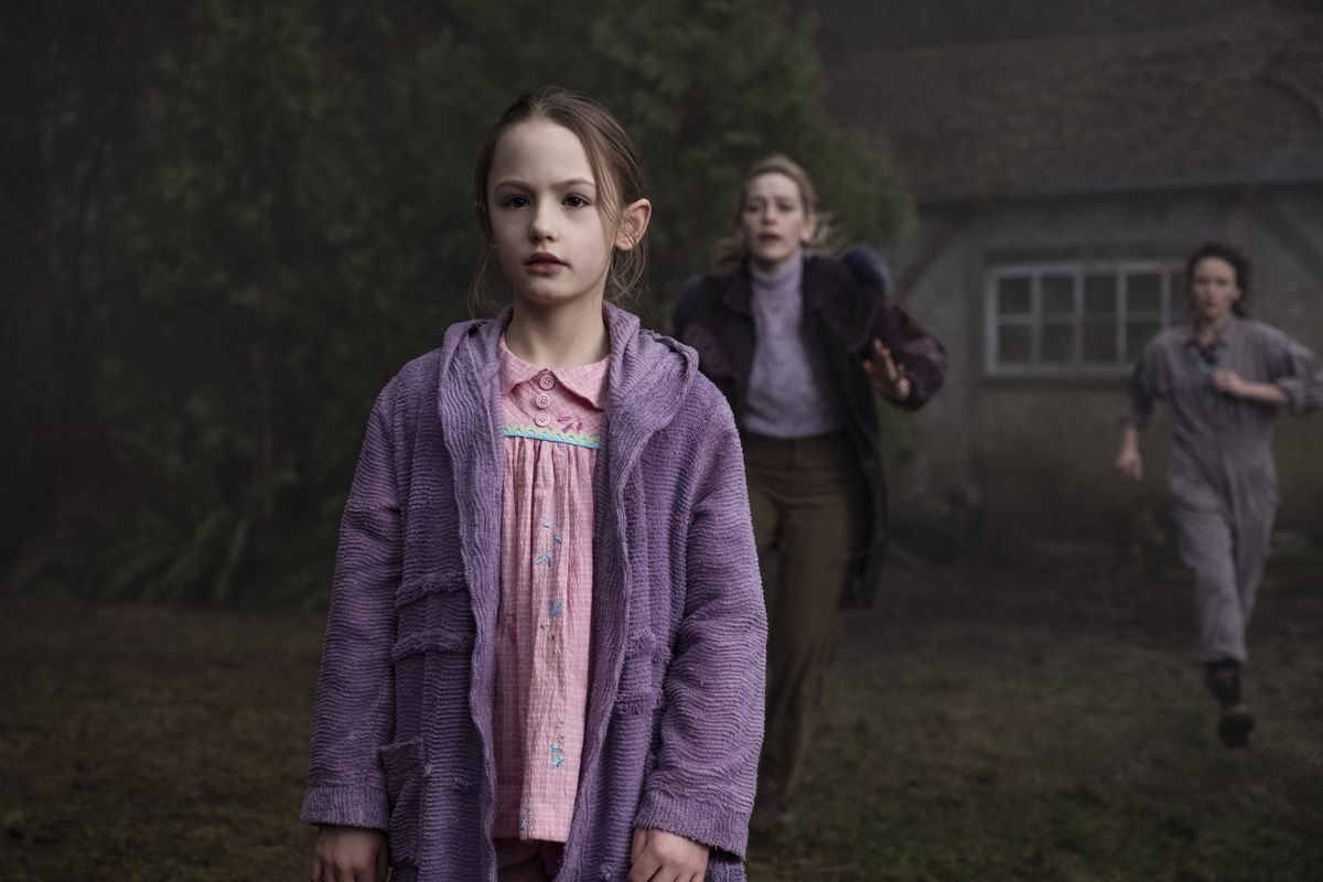 Dani Clayton (Victoria Pedretti) runs toward her daughter as she looks at something presumably spooky.