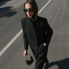 Model wears Mango cardigan with cream gloves