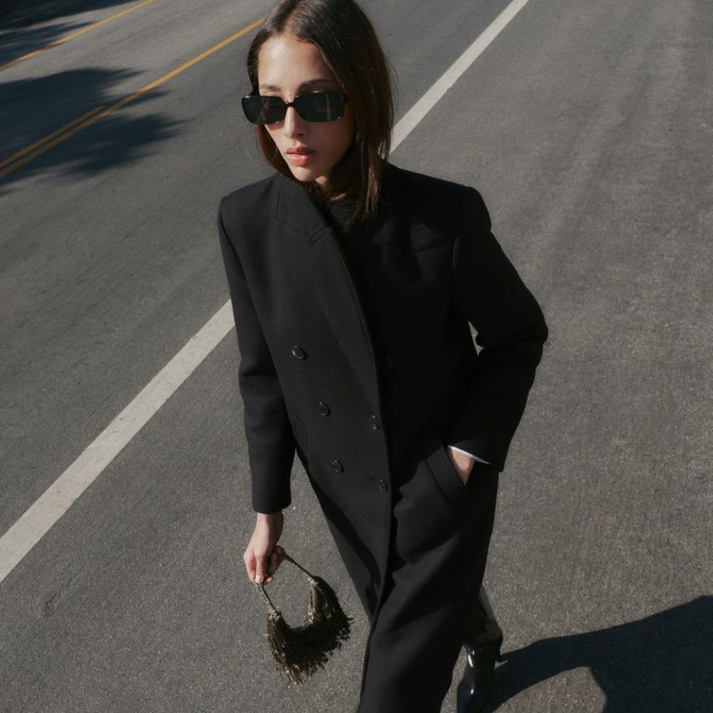 Model wears Mango cardigan with cream gloves 