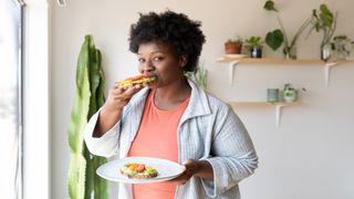 How to sleep: Image of woman eating a balanced breakfast