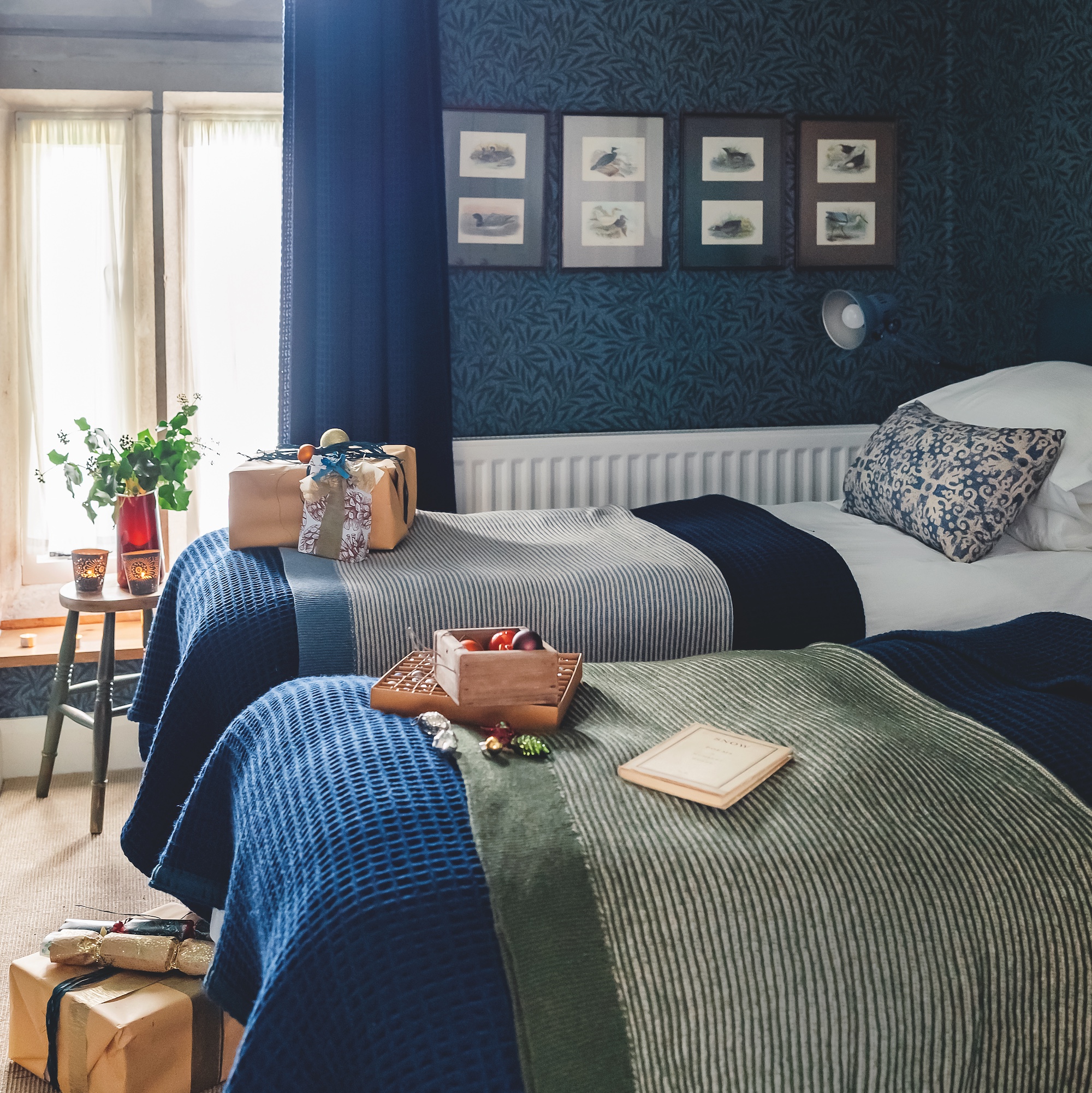 twin bedroom with Morris &amp;amp; Co navy willow bough wallpaper