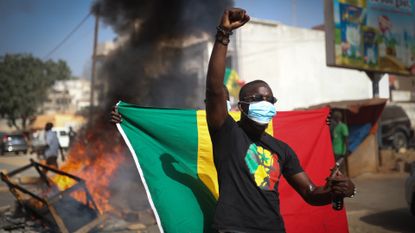 A man protests in Dakar, Senegal