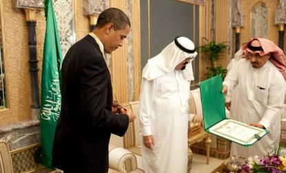 Saudi King Abdullah presents Obama with a medal in 2009, but the real Saudi treasures - a ruby and diamond jewelry set - were given to the first lady.
