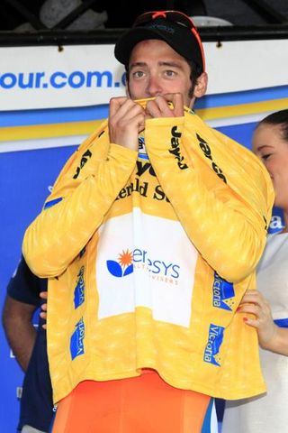 Nathan Haas (Genesys) kisses his yellow jersey on the podium at Arthurs Seat