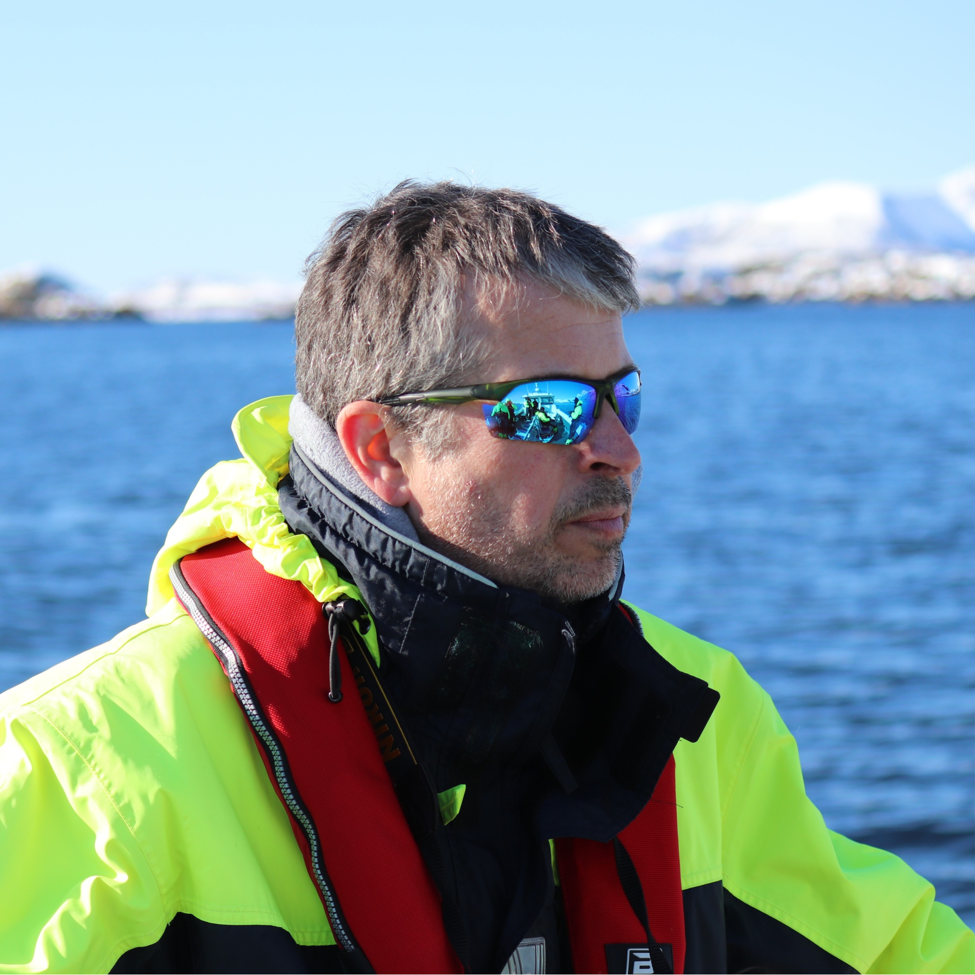 chris percival headshot, a man on a boat wearing sunglasses.